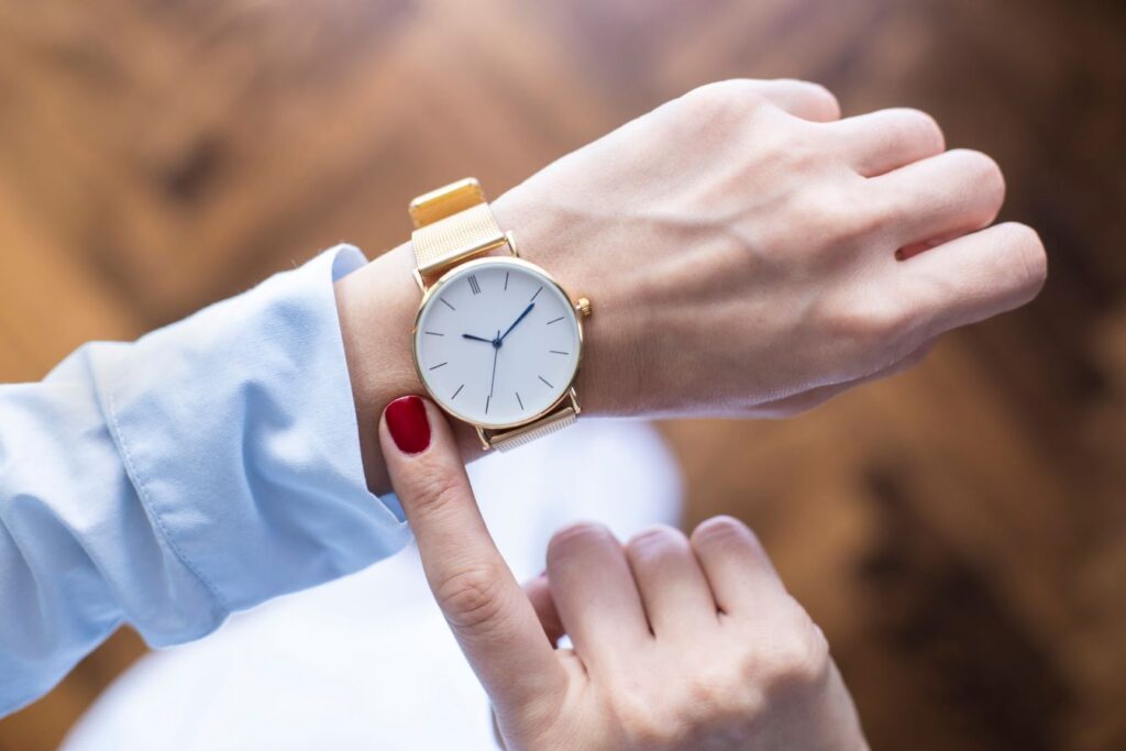 A woman looking at watch.